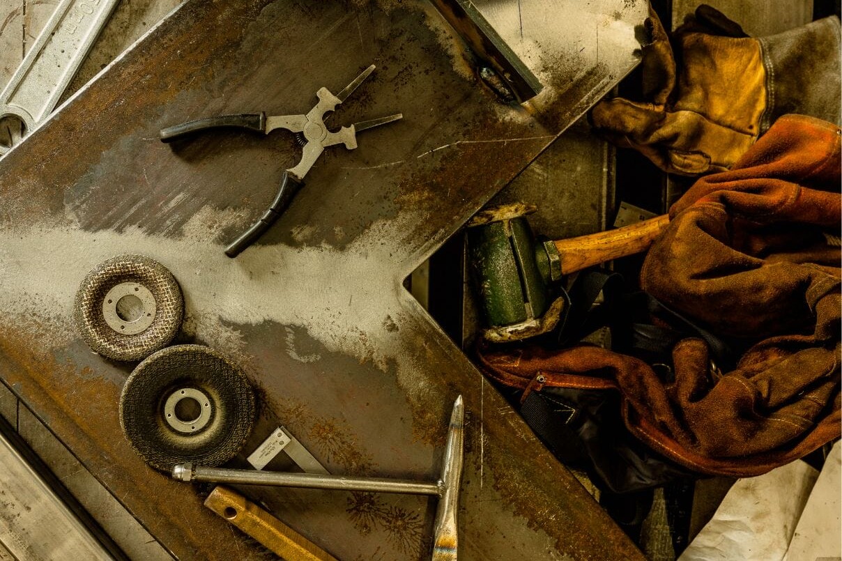 A group of tools on a table in Dyna Metal Shop.