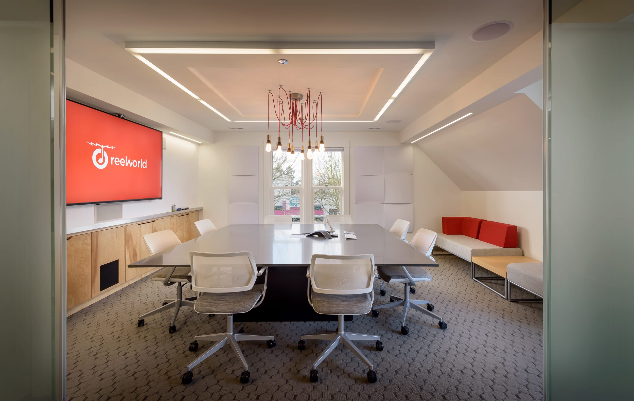 A conference room with a large table and chairs, ideal for carpenter consultations or home building discussions.