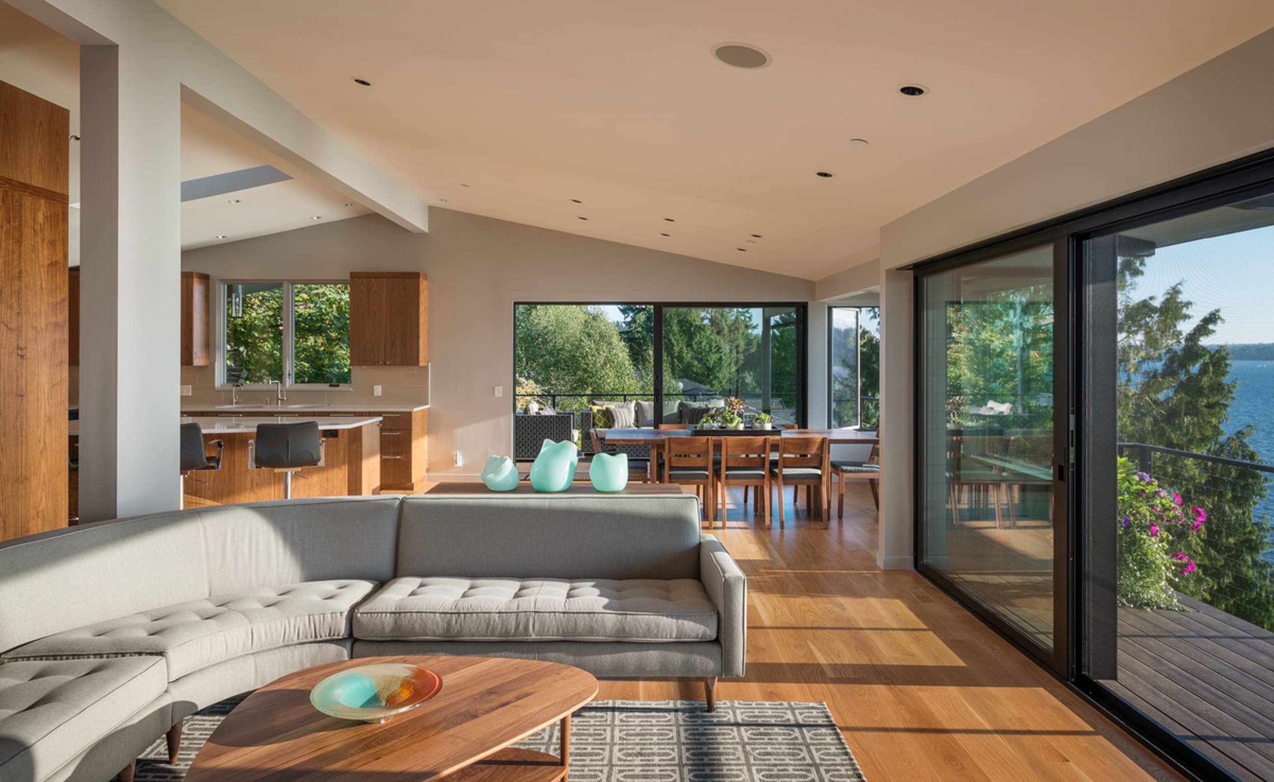 A living room with a couch and dining table.
