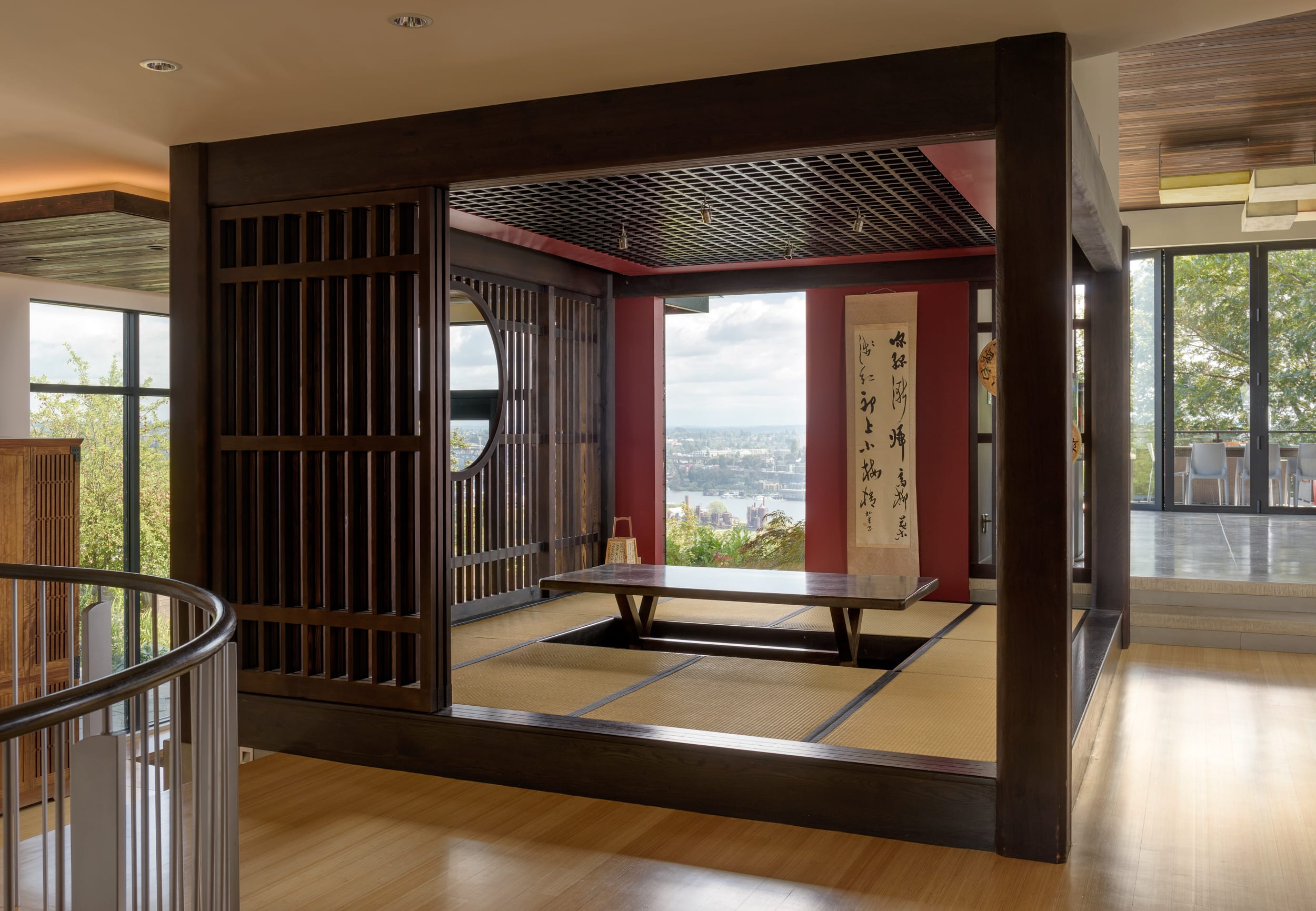 A japanese style living room with a wooden floor.